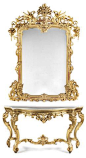 An Italian Rococo style carved giltwood console and mirror, late 19th Century