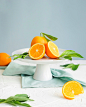 orange fruit in white ceramic plate close-up photography