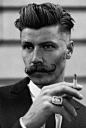 This guy is attractive in an interesting way, very nice hair style and the moustache is just amazing.