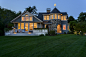 Example of a large beach style blue mixed siding gable roof design in Boston