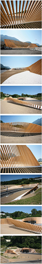 A large sinuous screen of wood designed by italian practice Cino Zucchi Architects defines a playful visual space at the entrance of the Vedeggio-Cassarate tunnel.