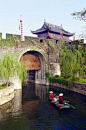 Suzhou's city wall is unique among all city walls in China.   It has two layers of "walls": one structured with bricks and another formed by a water channel that encircles the brick wall and connects to the waterways north to Beijing and south t