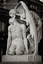 Beautiful sculpture: The Kiss of Death located at Barcelona's Poblenou Cemetery.