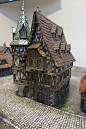 This may contain: a small model house on a table