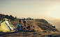 Young Couple Camping on Top of Hill