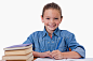 Smiling girl writing on a notebook