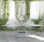 Contemporary table / chromed metal / aluminum / stone