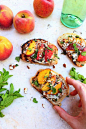 Summertime peach, honey, and mint bruschetta.  The perfect seasonal appetizer to feed a crowd!