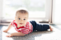 12 Month Old Beautiful Baby Boy Learns to Crawl at Home in the Sunlight