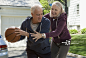 Senior couple playing basketball