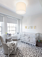 Transitional gender-neutral multicolored floor nursery idea in New York with white walls