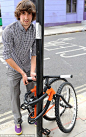21 year old design student Kevin Scott showed off a space-age bike that wraps around a lamp post so it can be locked-up safe.