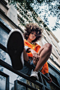 Low Angle View of  a Woman Sitting on Handrail