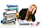 Royalty-free Image: Serious businesswoman looks at large pile of work…