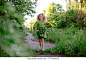 a little girl runs along the path happy in the Park in the spring