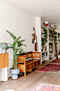 The hallway boasts customdesigned bookcases from Gramercy Design that were constructed by Stephen Fanuka. The ladder has...