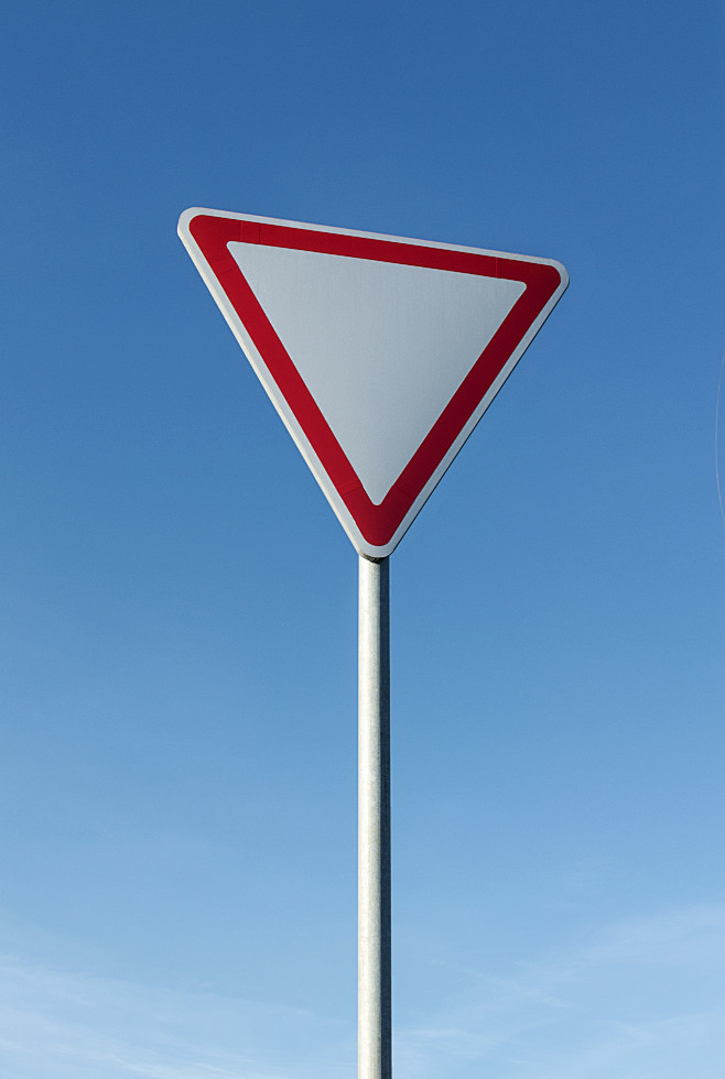 give-way-sign-blue-sky-background
