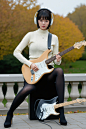  1girl, playing stratocaster-shaped guitar, natural finish electric guitar, stratocaster guitar, 
(pantyhose, high-heels), sweater, black hair, short hair, big breasts, (stand), outdoor,headphone,

masterpiece, best quality, 8k