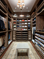 This is an example of a large traditional walk-in wardrobe for men in Miami with open cabinets, dark wood cabinets and dark hardwood flooring.