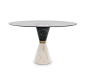 The Vinicius Dining Table is a perfect example of duality. The white marble contrasts perfectly with the black marble. The golden brass detail in the middle adds a luxurious twist of high end furniture that can convey the same feeling of expensive taste t
