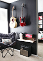 painting the wall black with bright guitars! great contrast...not sure about this for my basement jam room though: 