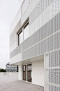 a f a s i a: RMDM perforated metal white facade different size perforations