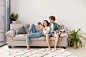 casal-completo-sentado-no-sofa_23-2148674067