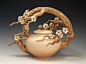 Ship Date: 2-4 weeks Wheel thrown whiteware non-functional teapot with sculpted branch handle with hand formed and attached plum blossoms. Underglazed with Soft coral blush and clear finish. Other col