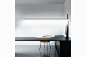Genoa - Habits : Genoa is a linear wall lamp, suspended via a steel tie rod. The 180° joint allows it to be freely adjusted to different positions, depending on the need and the desired lighting effect.