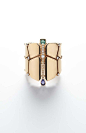 Hermès Niloticus rose gold cuff featuring a series of coloured stones including a pear-shaped iolite and a baguette-shaped beryl as well as brilliant-cut diamonds.