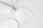 splash of white cream, tube and cosmetic cotton disk