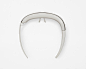 Photo by nendo on May 22, 2024. May be an image of barrette, hairpin and text.