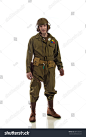 Man actor in military uniform of American tankman of World War II posing on white background
