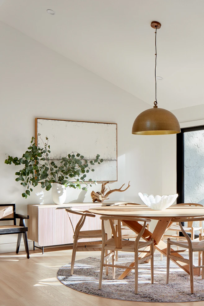 Trendy light wood floor, beige floor and vaulted ceiling dining room ...