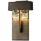 Shard Outdoor LED Tall Wall Sconce : The Hubbardton Forge Shard Outdoor LED Tall Wall Sconce features hand poured glass lit with energy efficiency. The clear glass block contains smoke glass shards, creating an interesting texture for the light to shine o