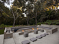 15 Outdoor Conversation Pits Built For Entertaining // This outdoor concrete living space contrasts the lush greenery surrounding it and makes it feel extra modern.