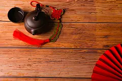 紫砂壶扇子新年春节背景素材摄影图片