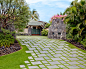 This is an example of a world-inspired driveway full sun garden in Hawaii.