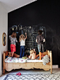 On encouraging kids’ hobbies: I try to keep my kids’ interests in mind when making decor decisions. My daughter loves to draw, so I made this entire wall a chalkboard wall. That way, she can draw to her heart’s content!: 