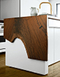 The countertop design makes the woods' 'flaws' part of the design!!