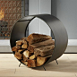 Shop chuck log holder.   Round up some wood for the fire.  Handcrafted of iron with antiqued zinc finish, industrial drum gathers kindling, elevated just off the ground on angled legs.: 