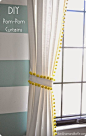 Neon yellow trim with dangling pom-poms adds texture and serious fun factor to all-white curtains.: 