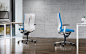 König + Neurath Lamiga office chairs by ITO Design with white backrests and blue upholstery in minimalist office