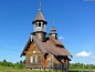 Classic slant room wooden church of St. Basil the Great was built in year of 2000 by St. Petersburg artist Gretsky in Akulova mountain village.