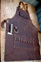 I made this leather apron as a custom order for a guy who wanted it all in his kitchen. The knife pocket holds a large chefs knife and the brass