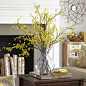Artificial Forsythia Branch | About 7 branches at $10.36 per branch in a rounded glass vase: 