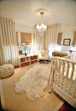 Neutral nursery with blinds and floor length curtains: 