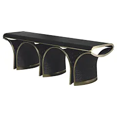 The Nymphea Bench by R &amp; Y Augousti is a part of their new Rattan capsule launch. The piece explores the brand's iconic DNA of bringing old world artisanal craft into a contemporary and utterly luxury feel. This seating piece is done in a black rattan