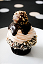 Chocolate Truffle Cupcake dark chocolate ganche with hazelnuts, topped with milk chocolate buttercream, more ganache and a hazelnut crunch