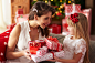 Mother and daughter face to face during exchanging presents